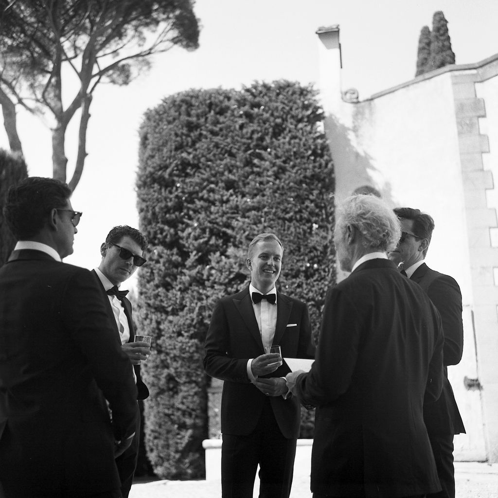 “Rob greeting guests with his cobest men Ally and Sujit.”