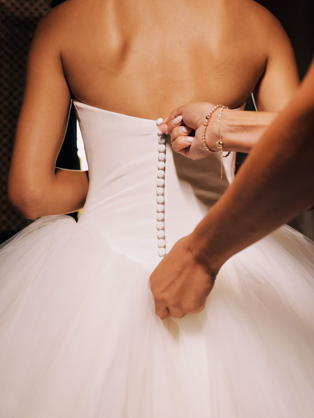 “My sister who attended every single dress trial and fitting over the last eight months zipping me in before the big...