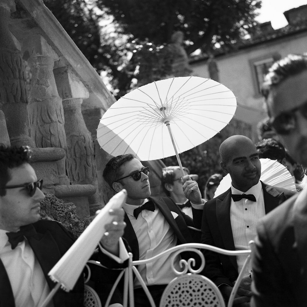 “Our wedding day ended up being one of the first hot days of May and our guests made good use of the parasols wed...