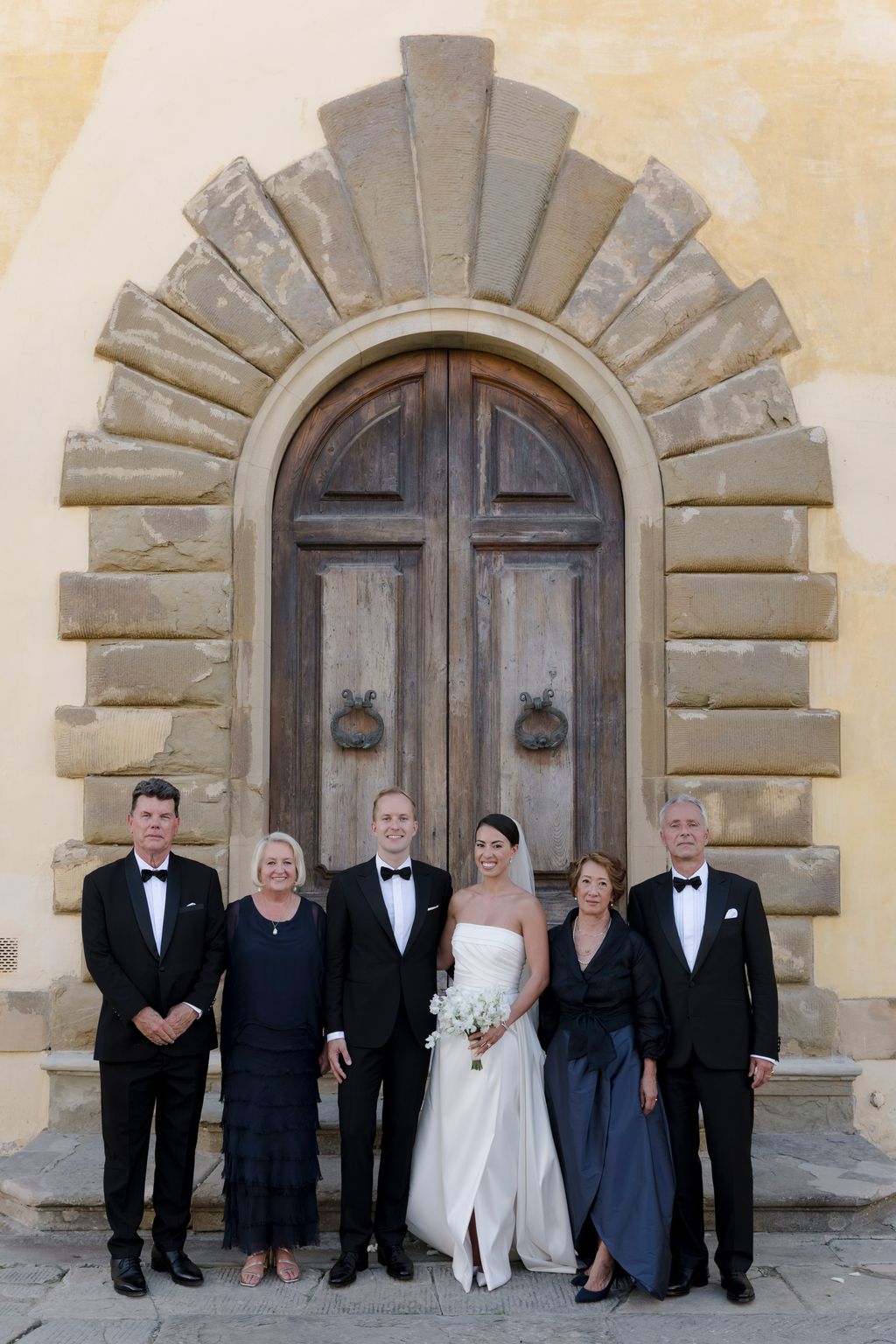 “Portraits with our wonderful parents and our mothers unintentionally matched in navy blue.”