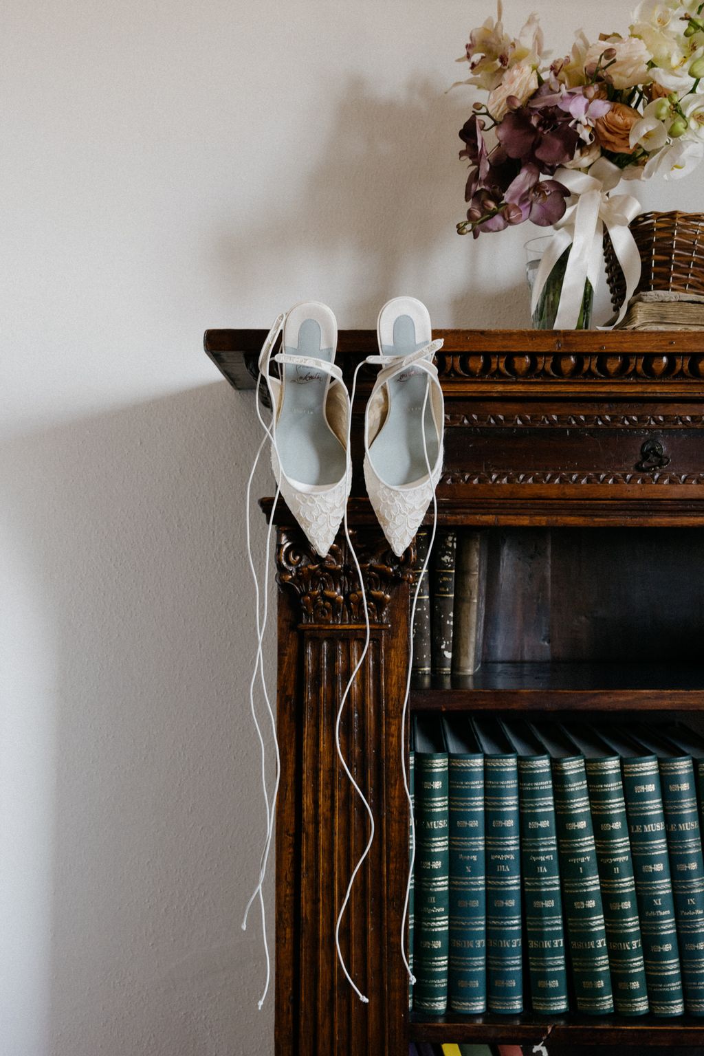 Image may contain Clothing Footwear Shoe Furniture High Heel Bookcase Flower and Plant