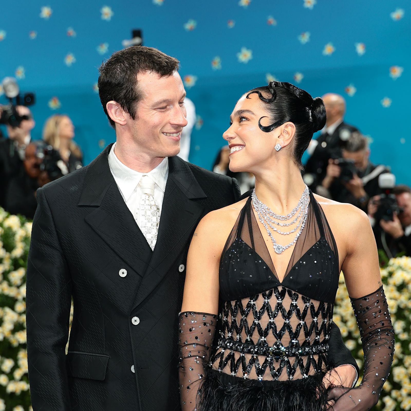 Dua Lipa’s Chanel Look For The 2025 Met Gala Is Adorned With Feathers, Crystals… And Callum Turner