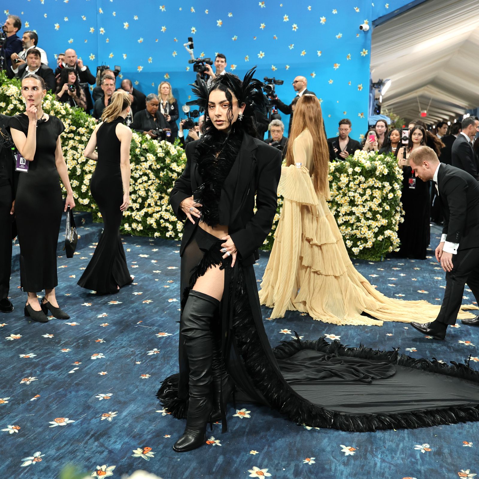 Charli XCX Brings Gothic Glamour—and a Dramatic Feathered Headpiece—to the 2025 Met Gala