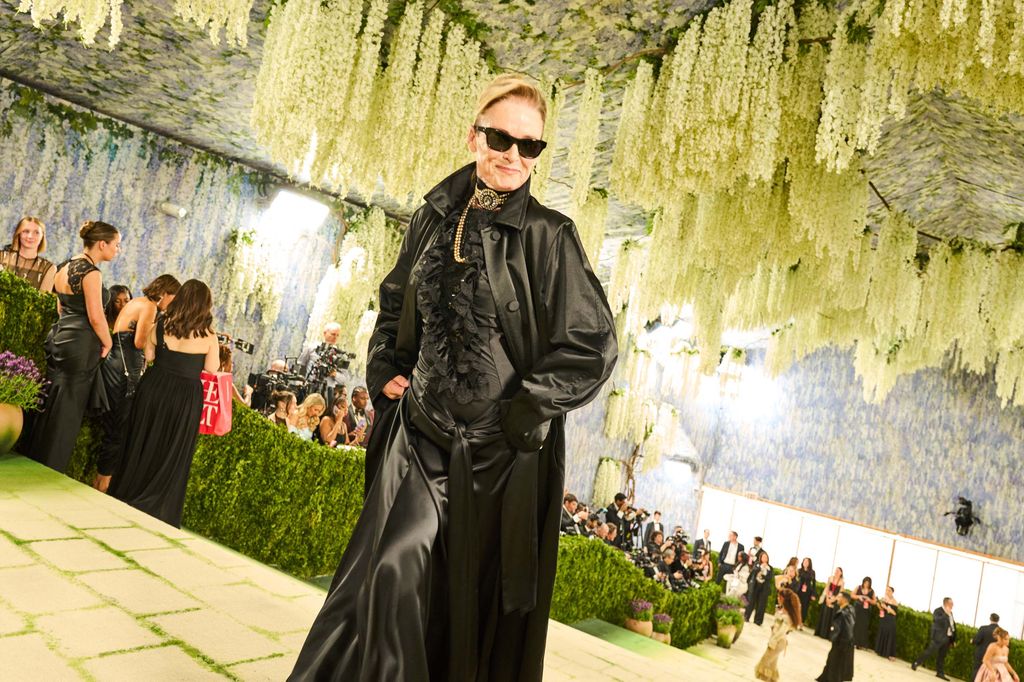 Image may contain Pamela Hanson Jonathan Cyprien Clothing Coat Fashion Person Adult Face Head and Photography