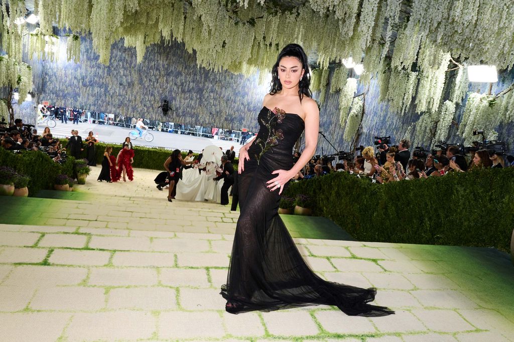 Image may contain Charli XCX Clement of Alexandria Clothing Dress Formal Wear Evening Dress Fashion Gown and Adult
