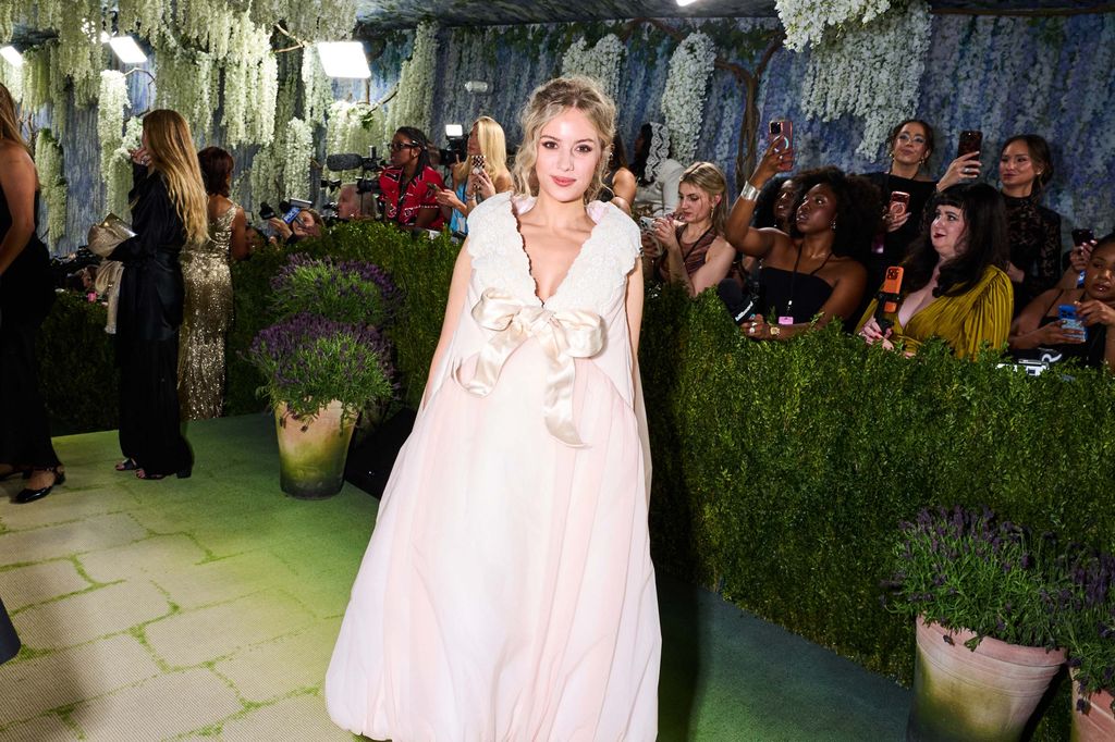 Image may contain Person Fashion Photobombing Adult Wedding Clothing Dress and Formal Wear