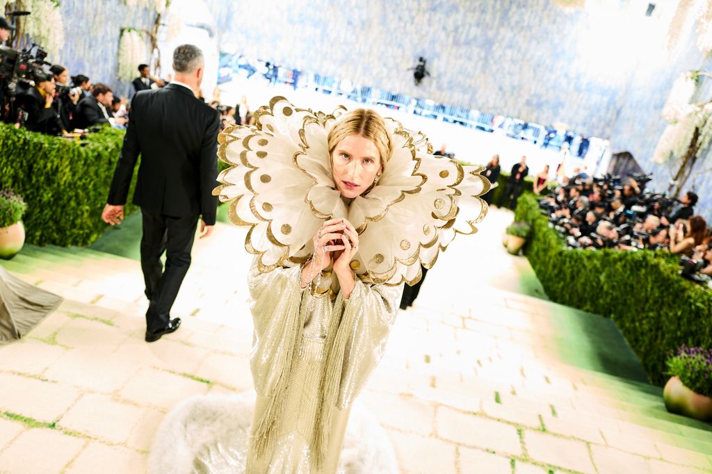 Image may contain Dree Hemingway Clothing Costume Person Face Head Photography Portrait Dress and Fashion