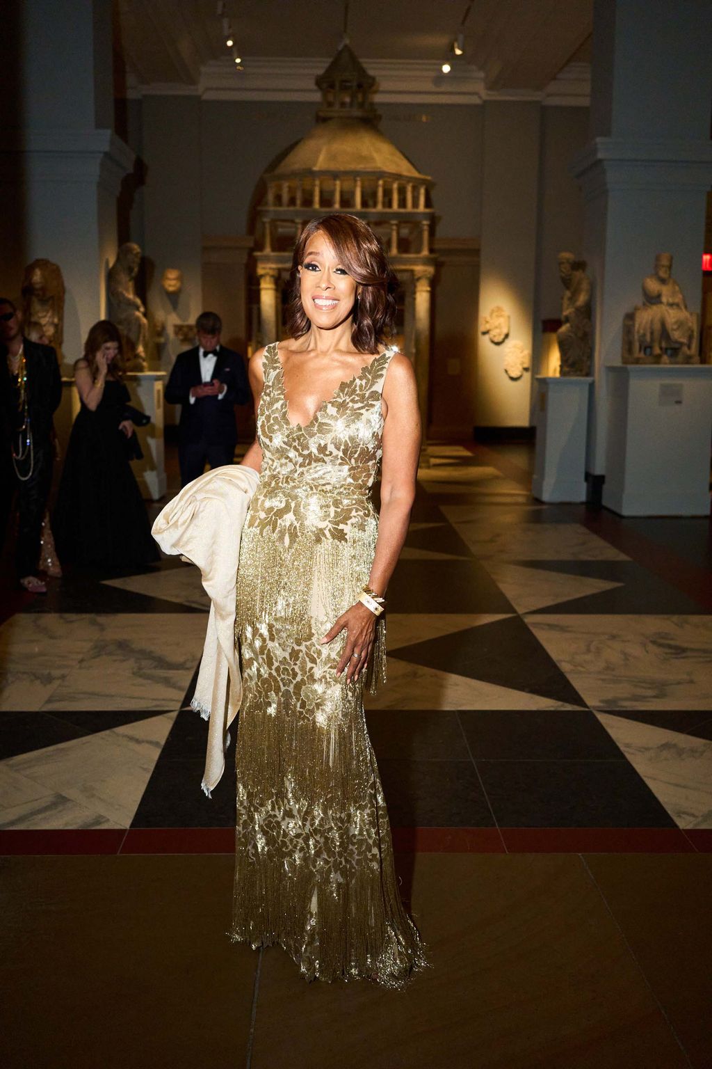 Image may contain Gayle King Person Clothing Dress Adult Wedding Formal Wear Accessories Glasses Suit and Indoors