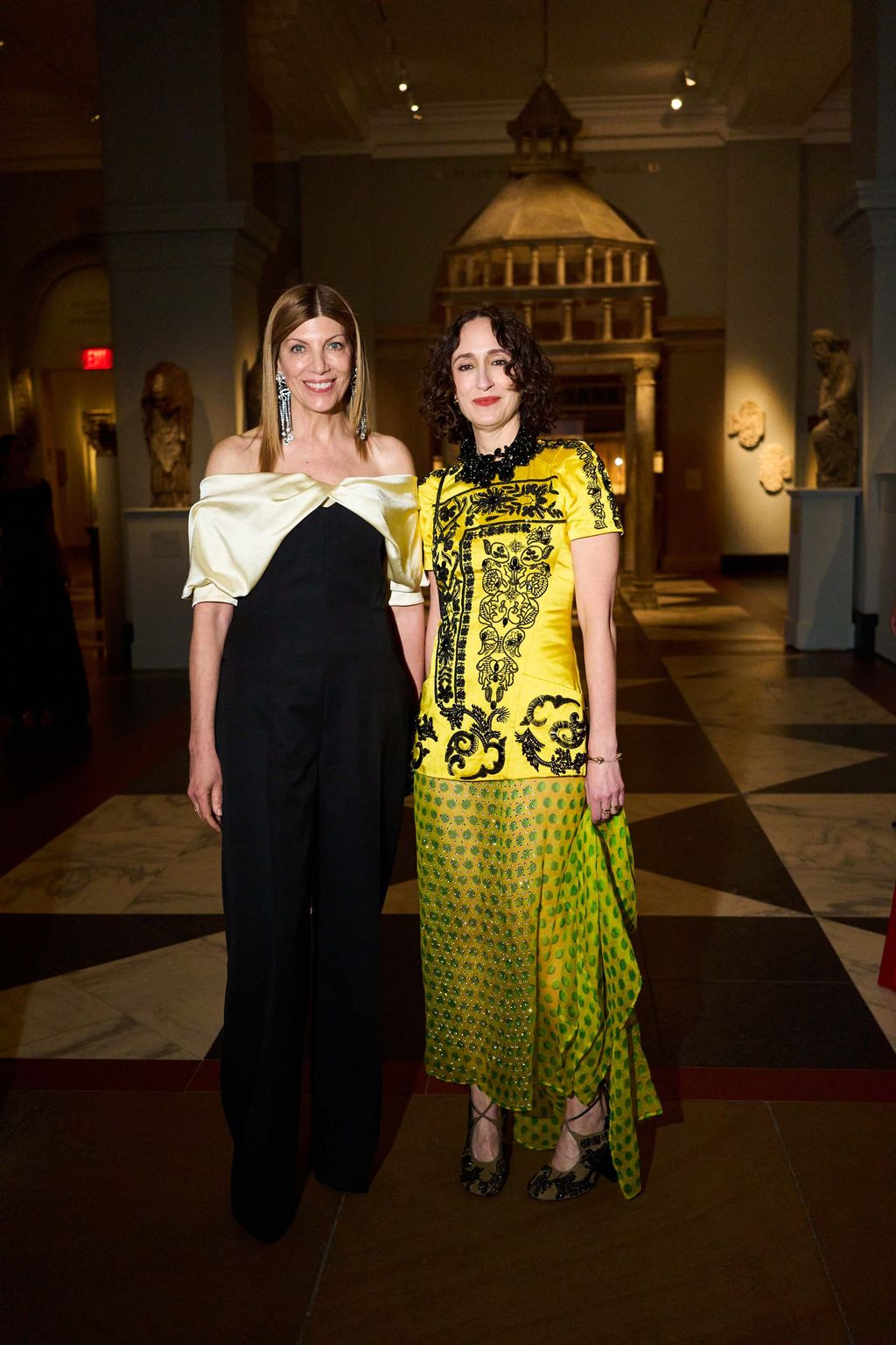 Image may contain Tori Spelling Clothing Dress Lighting Formal Wear Evening Dress Face Head Person and Photography