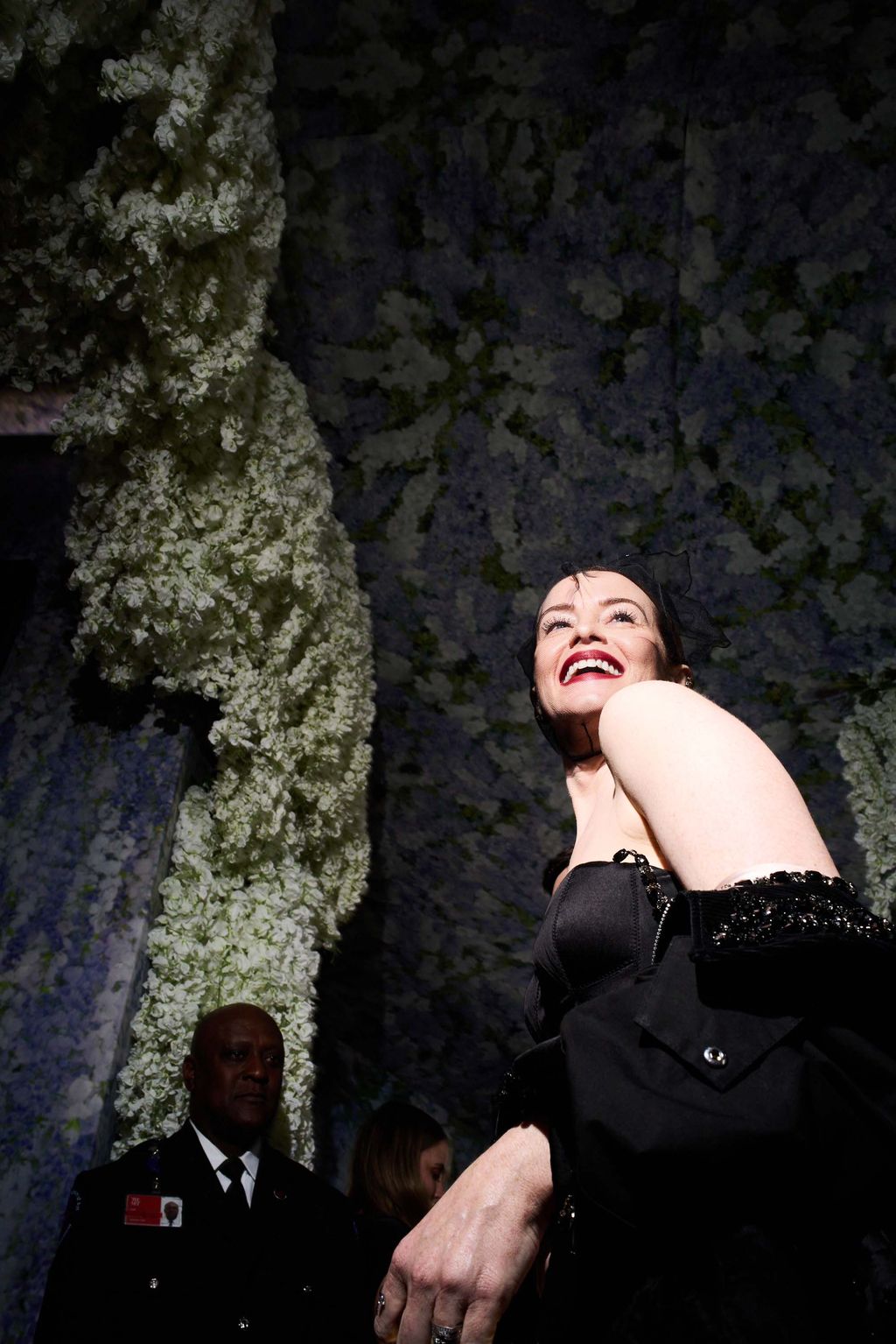 Image may contain Claire Foy Face Head Person Photography Portrait Clothing Formal Wear Suit Plant and Vegetation