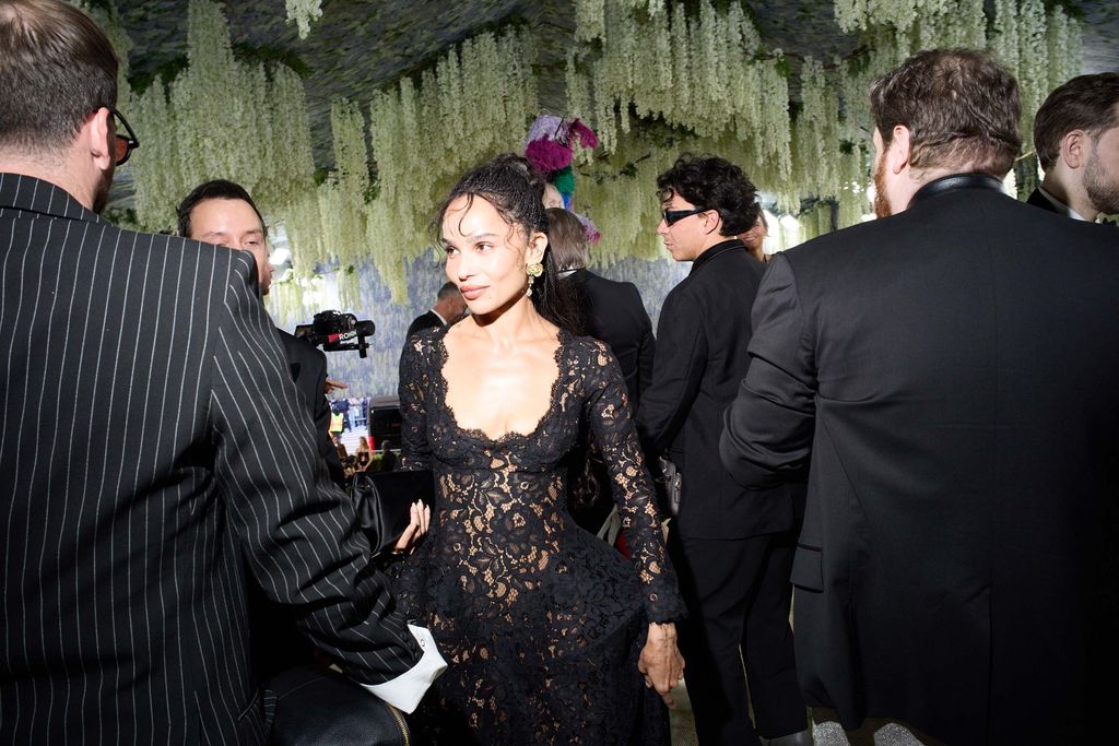 Image may contain Zoë Kravitz Fashion Clothing Dress Formal Wear Suit Adult Person Wedding Photobombing and Coat