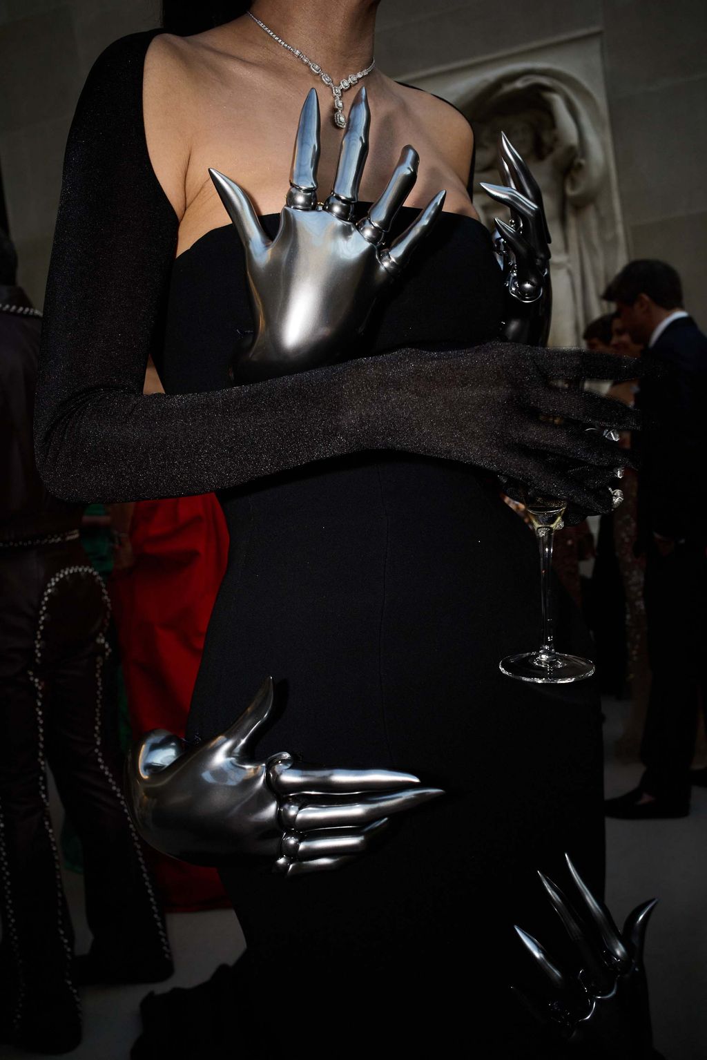 Image may contain Clothing Glove Adult Person Electronics Hardware Claw and Hook