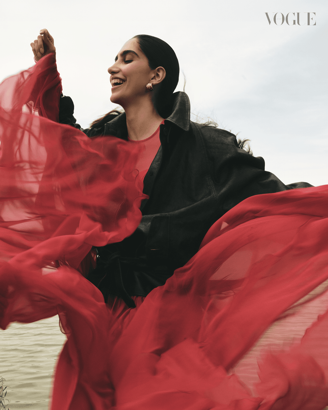 Jacket Magda Butrym. Top Elisabetta Franchi. Skirt Kristina Fidelskaya. Earrings and bangles Elisabetta Franchi.